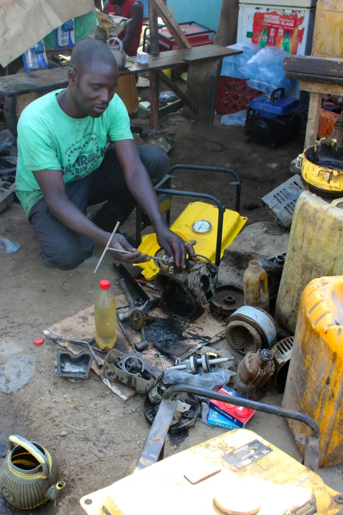 Man repairing ze-gen generator